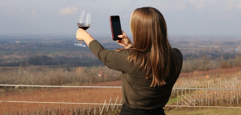 Enjoying Serbian wine with a view of the vineyards