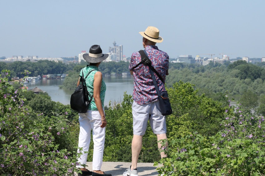 Couple overlooking rivers in Belgrade at the start of a multi-country Balkan journey